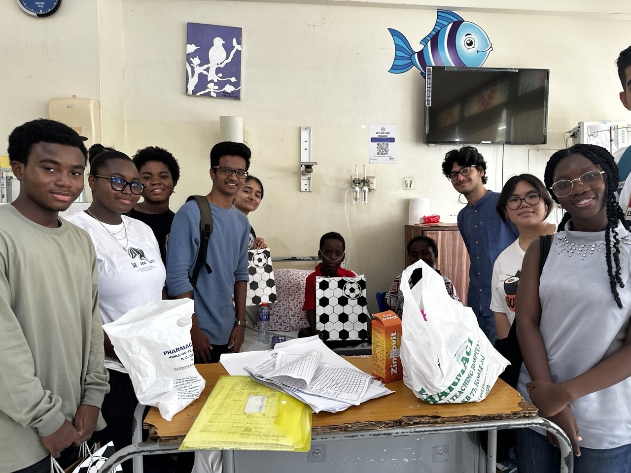 Volunteers visiting a child on the cancer ward
